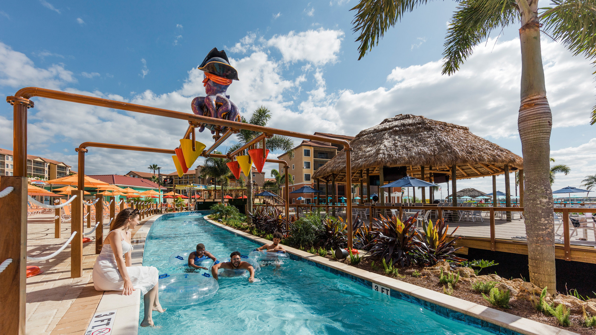 treaure cove water park - two guests floating downt the lazy river - westgate lakes resort & spa