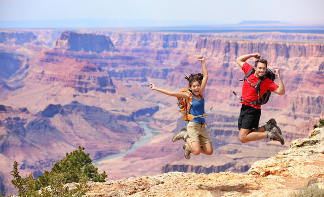Couple jumping in front of grand canyon - Groups and Meetings