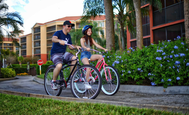 Father and daughter rent bicycles at Westgate Lake Resort - Family Resort Near Orlando Theme Parks