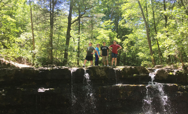 Kids Standing on Rocks by Waterfall | Special Offers at Westgate Branson Woods Resort