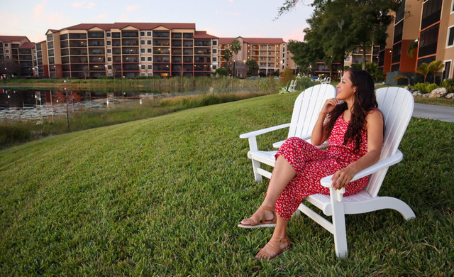 Resort Overview | Woman Sitting on Chair Looking at Lake