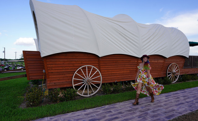 Westgate River Ranch Resort and Rodeo Accommodations | Woman Walking Outside Room