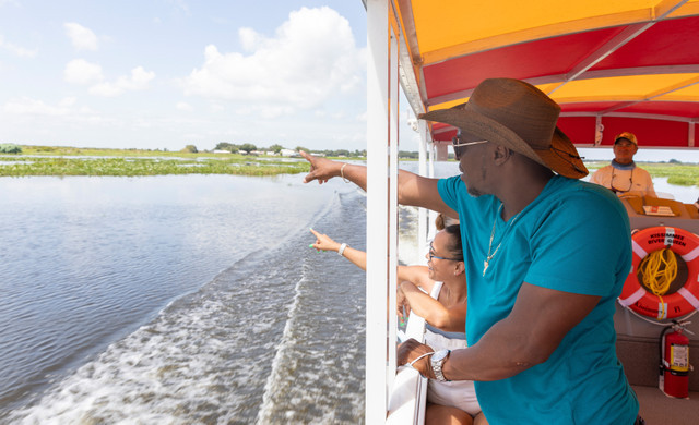 Activities  | Florida Dude Ranch & Luxury Glamping Resort | Family Riding in Boat