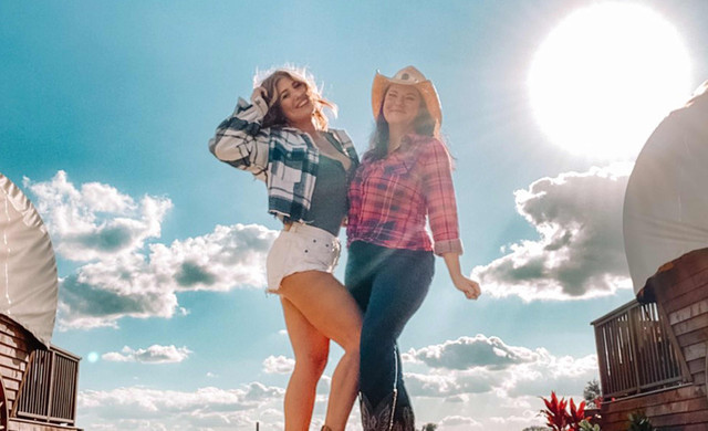 Girls Posing in front of Wagon | Westgate River Ranch Resort & Rodeo in River Ranch Florida | Westgate Resorts