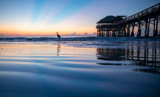 Cocoa Beach Pier With Sun Setting in the Background