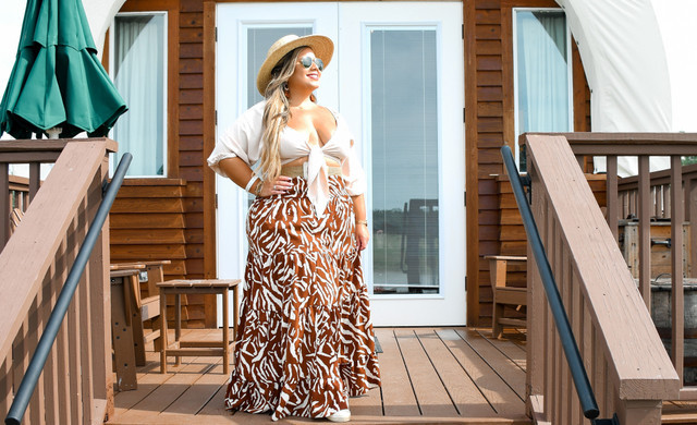 woman in front of luxury glamping accommodations - westgate river ranch