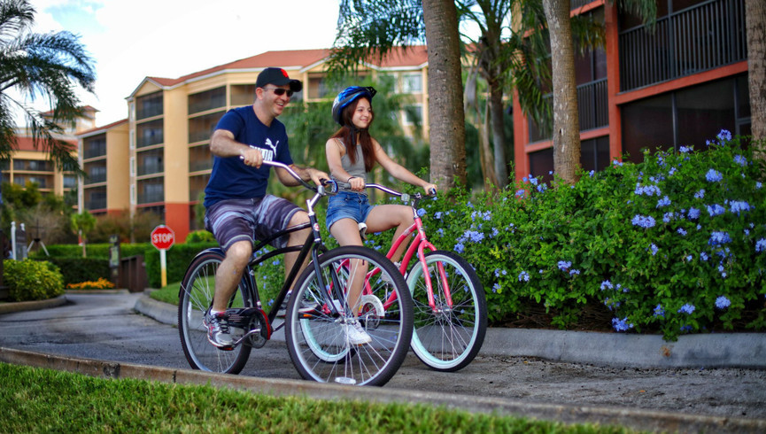 family riding bicycles at resort - westgate vacation villas resort