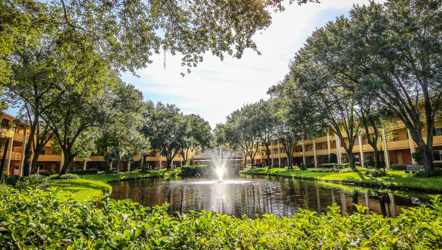 Westgate Leisure Resort Phone Directory | Lake with Fountain in the Middle of Buildings