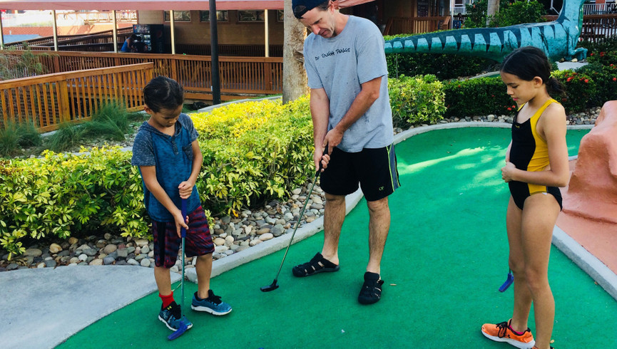 Family Enjoying Mini Golf - Amenities at Westgate Vacation Villas Resort