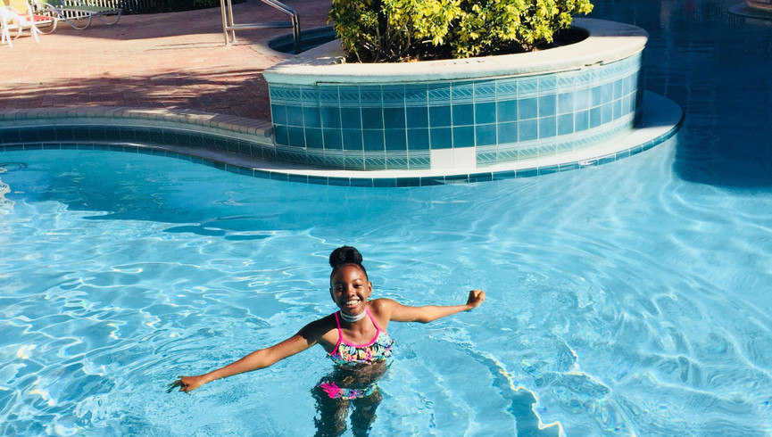 Girl Soaking in the Resort Pool -Amenities at Westgate Vacation Villas Resort