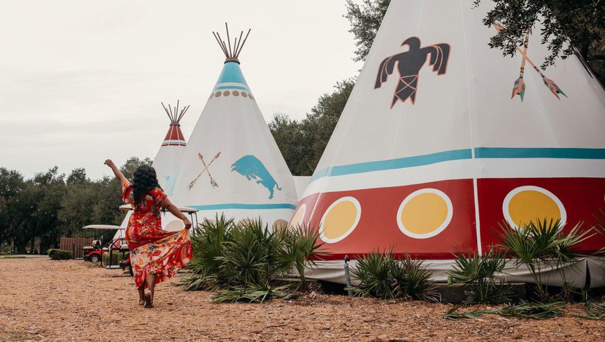 Woman in Front of Teepee | Westgate River Ranch Resort & Rodeo