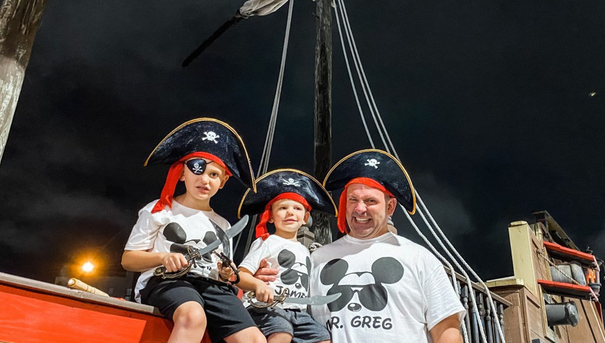 Family in Front of Pirate Ship - Orlando Resort Family Friendly Activities - Amenities at Westgate Town Center