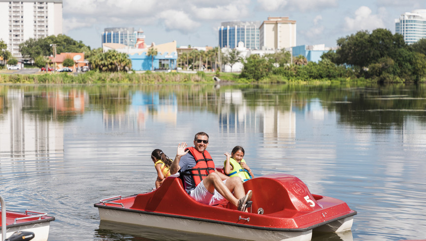 Staff Member Holding Basketball at Rental Station | Activities Available at Westgate Lakes Resort