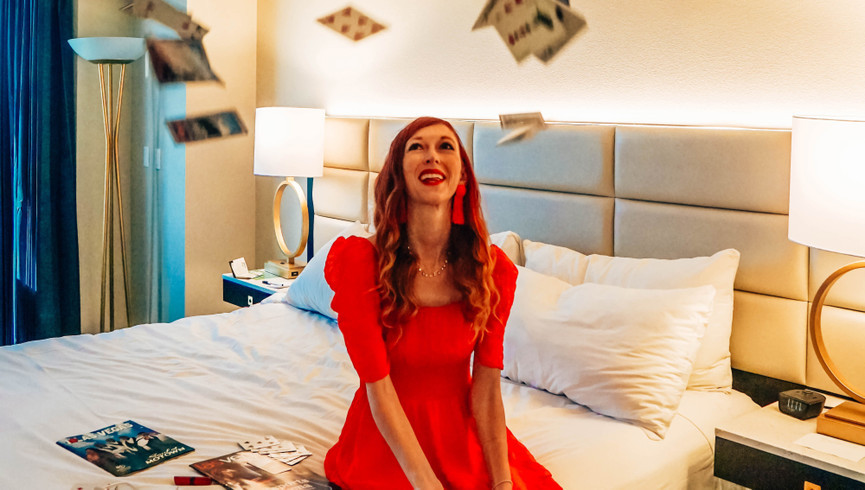 happy woman in red dress las vegas gambling win - westgate las vegas resort & casino
