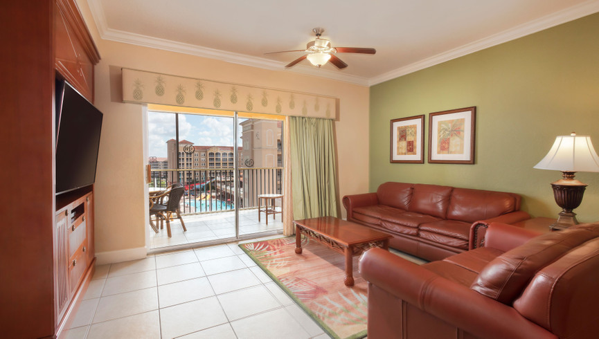 Spacious Living Room with Pool View & Flat Screen TV - Luxury Villas in Orlando Westgate Town Center Resort