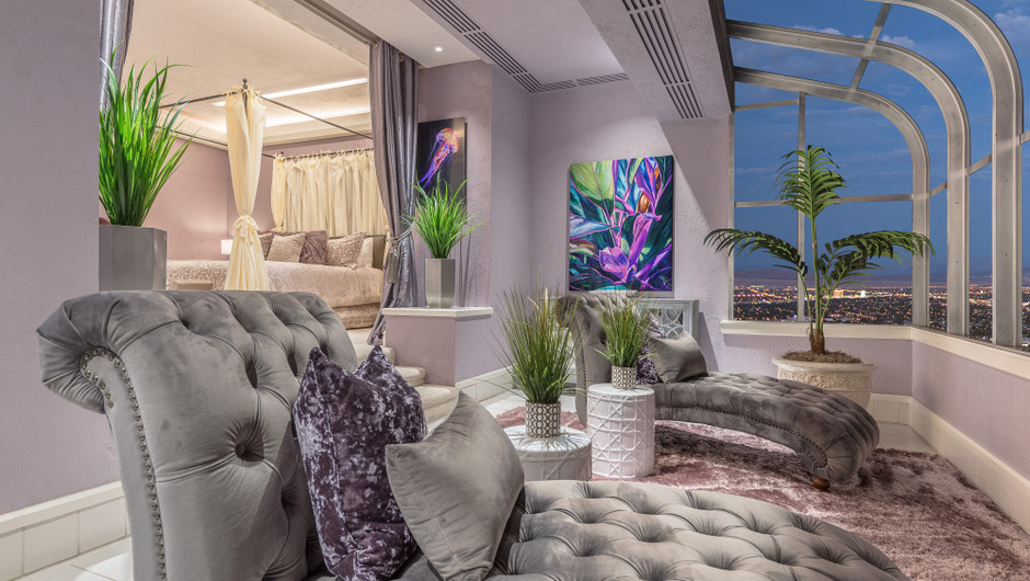 Bedroom with sitting area and city views in the Bahamas Suite - Westgate Las Vegas Resort & Casino