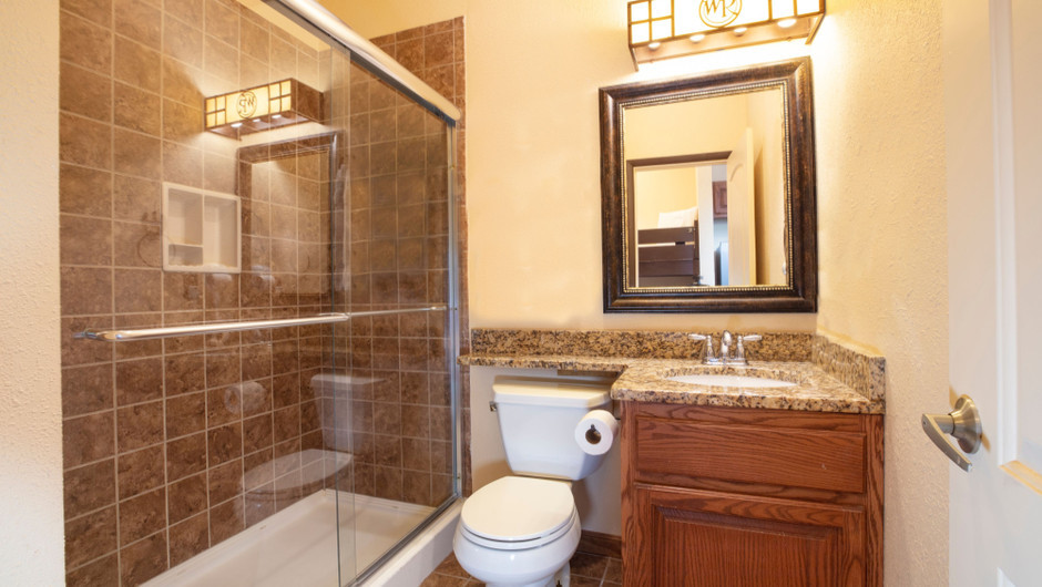 Bathroom in our Saddle Club Rail Car - Bedroom in the Saddle Club Rail Car - Westgate River Ranch Resort & Rodeo
