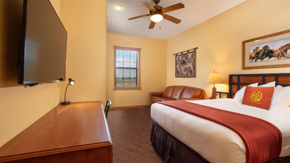 Bedroom in our Saddle Club Two-Bedroom Cabin - Westgate River Ranch Resort & Rodeo