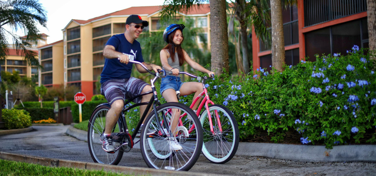 family riding bicycles at resort - westgate vacation villas resort