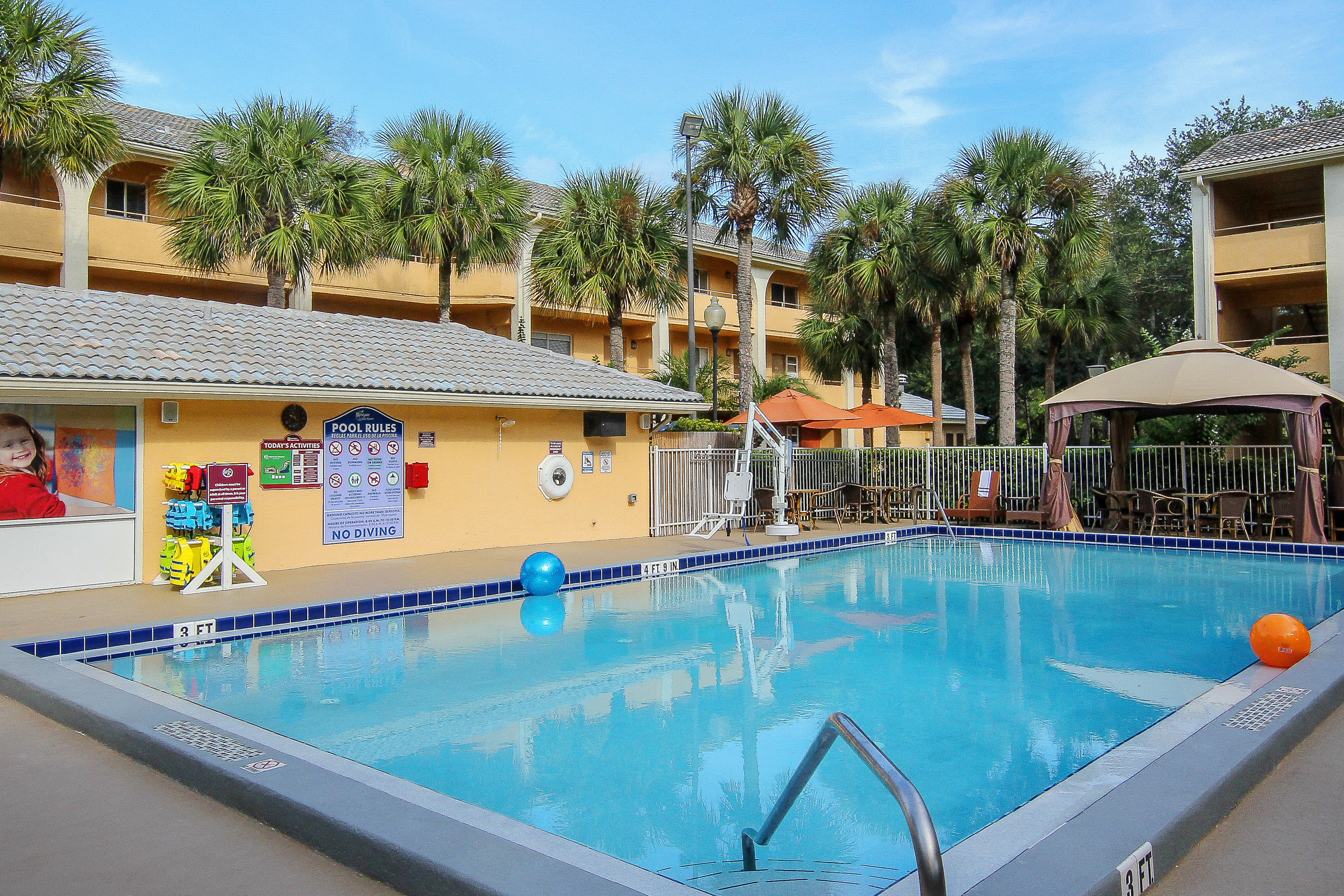 Heated outdoor pool with resort building in background | Westgate Leisure Resort | Westgate Resorts