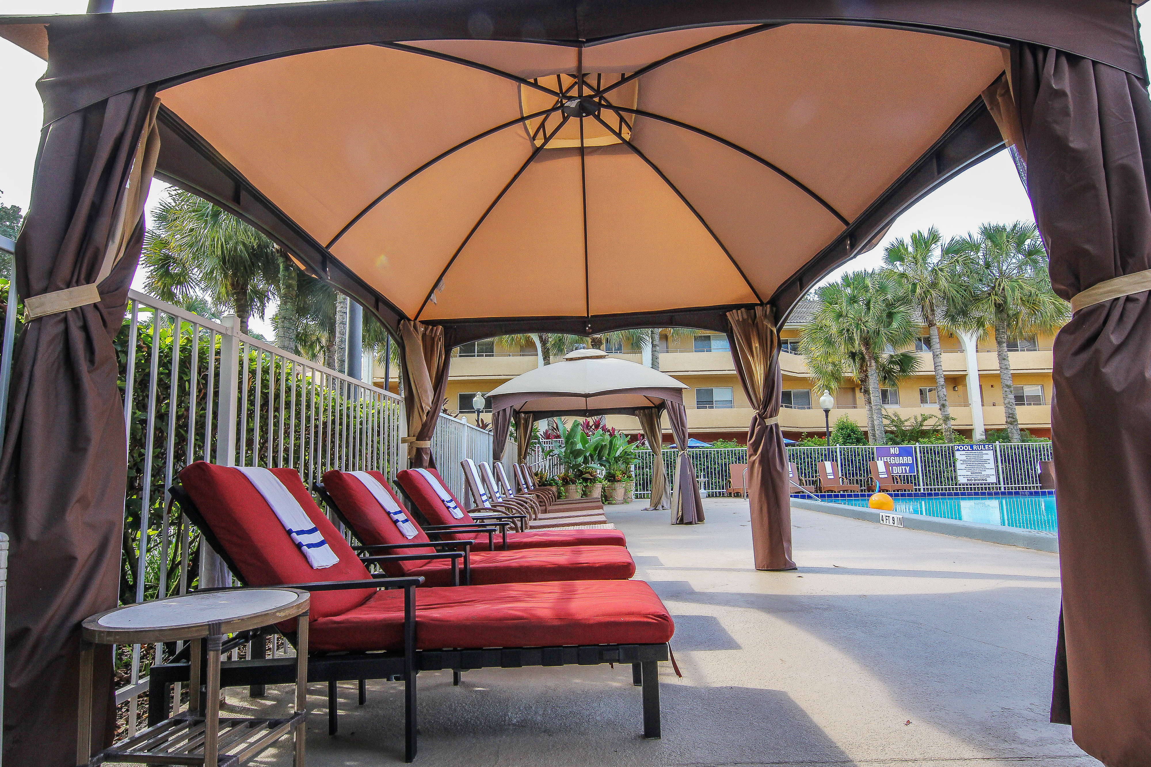 Pool deck with lounge chairs and cabanas | Westgate Leisure Resort | Westgate Resorts