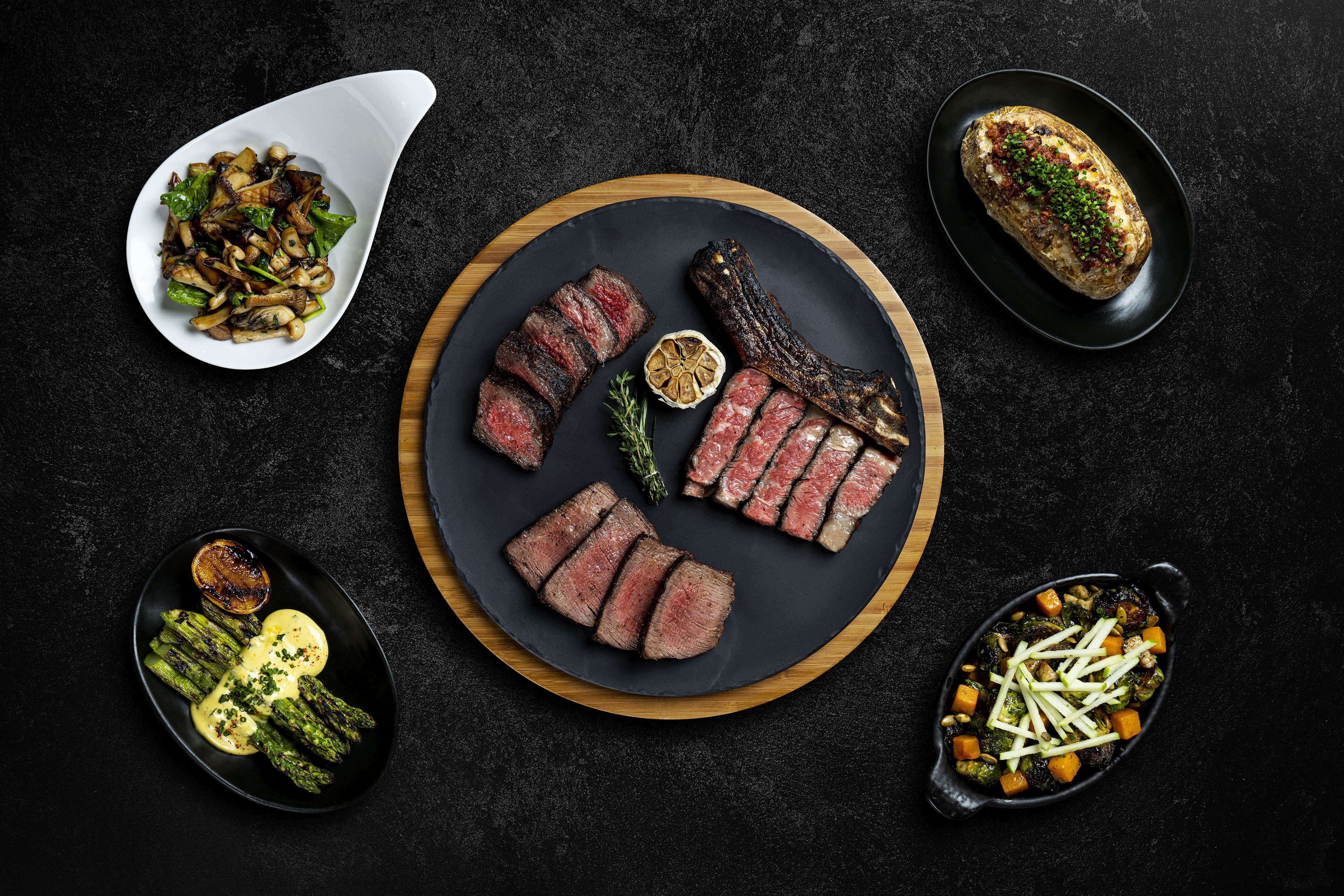 Aerial Shot of Food Plated on Table | Edge Steakhouse