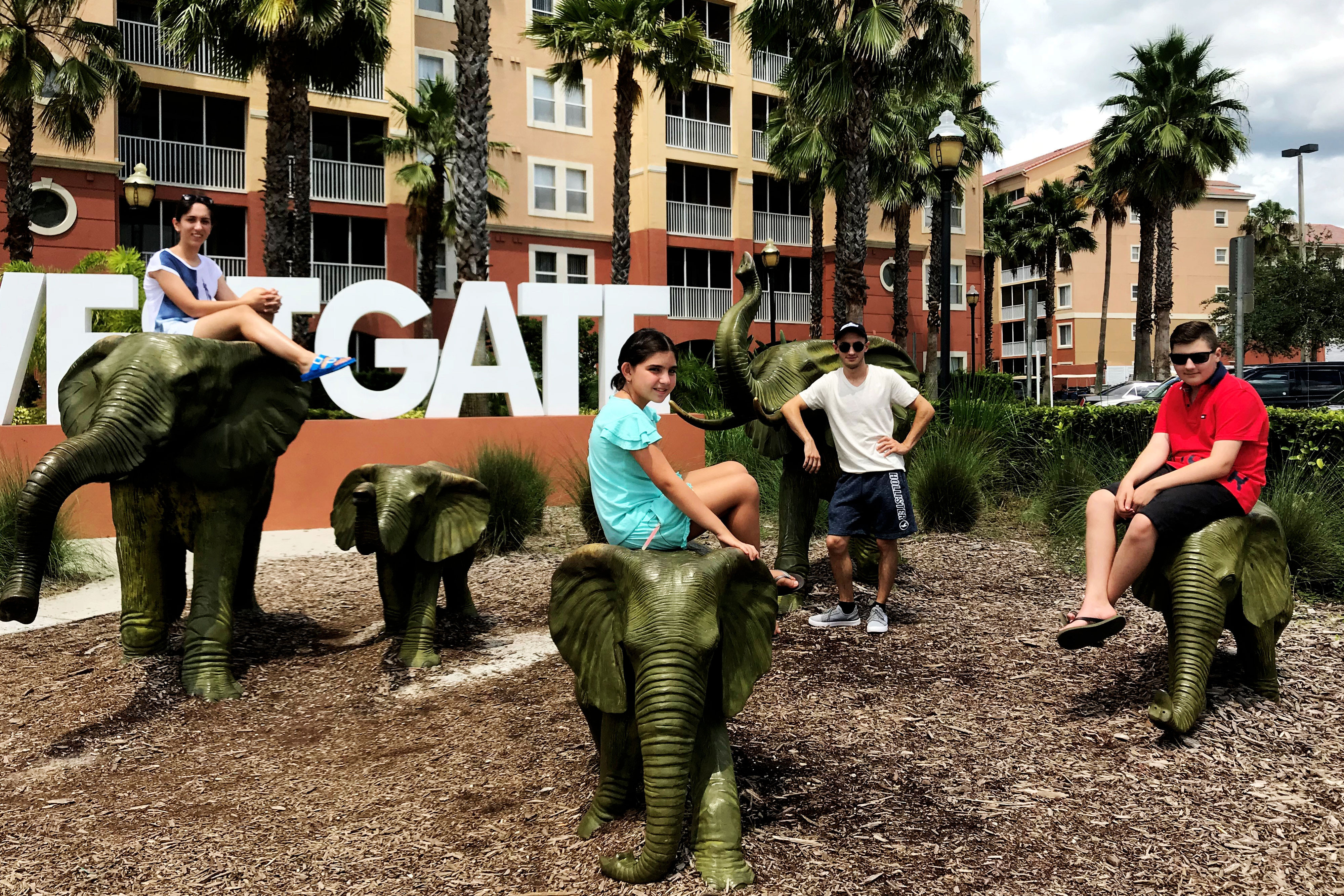 Family posing with elephant statues - Westgate Town Center Resort