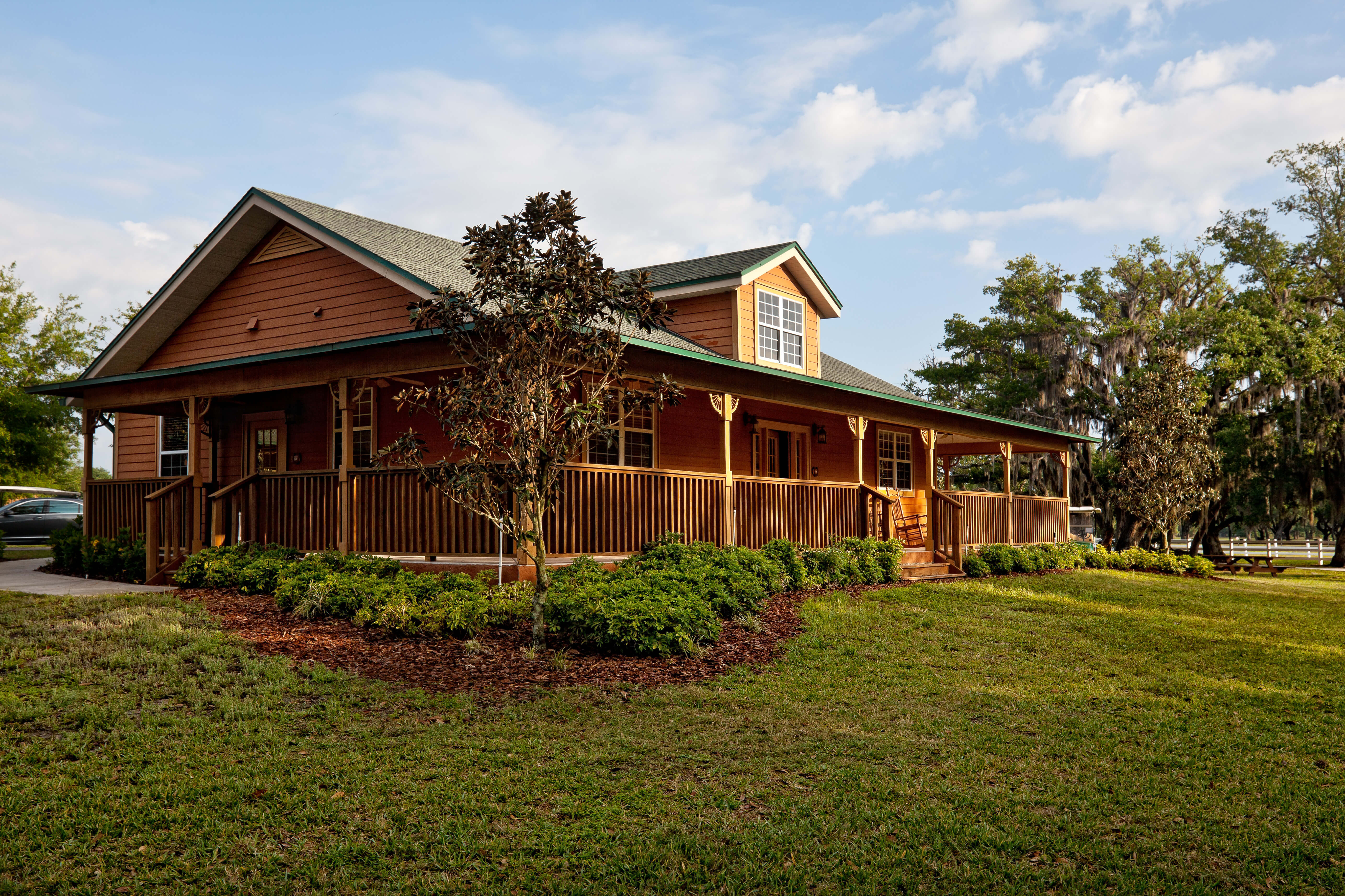 Exterior of Cabin with Rocking Chairs | Westgate River Ranch Resort & Rodeo