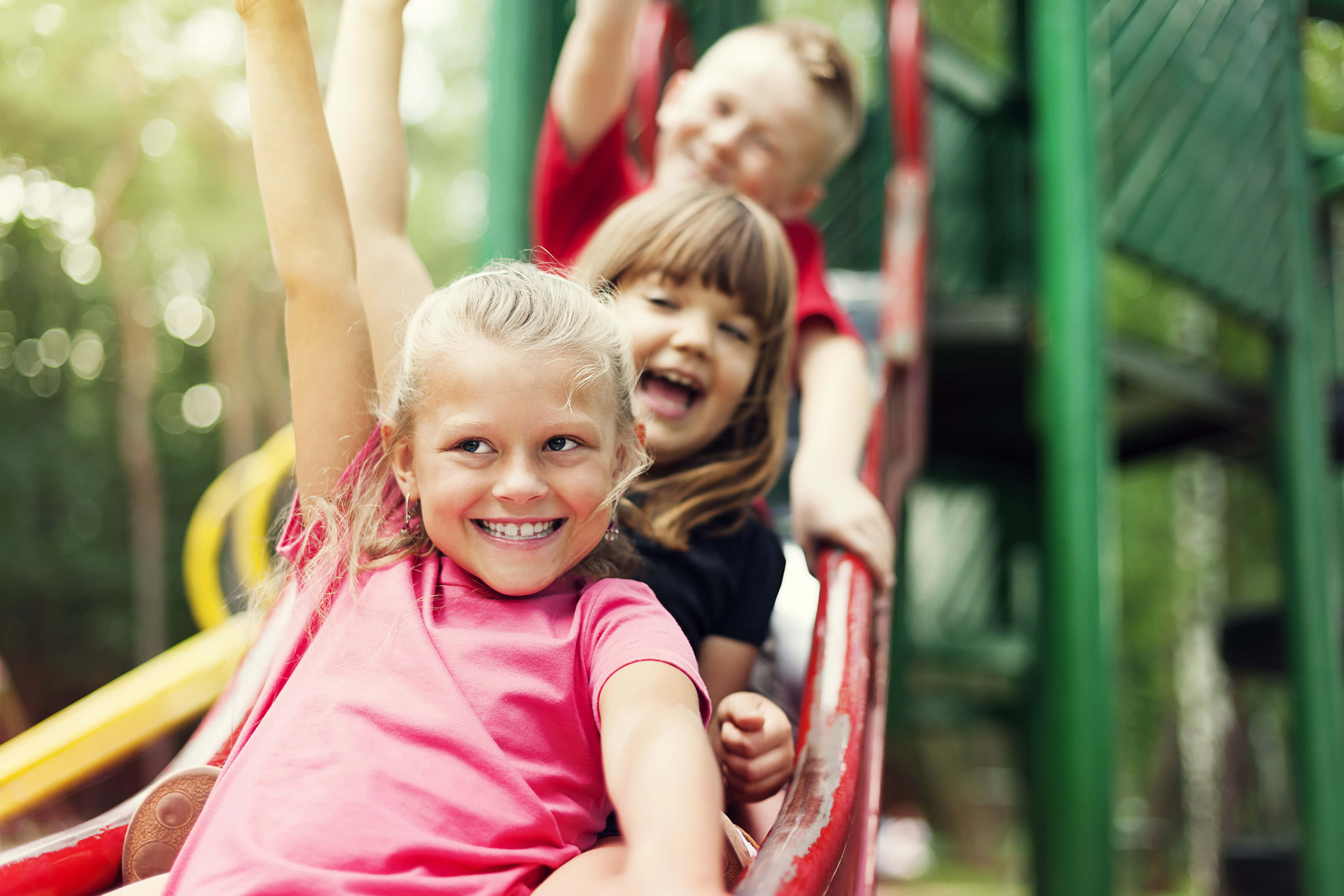 Kids on slide at onsite Playground | Westgate Branson Woods Resort | Westgate Resorts in Branson MO