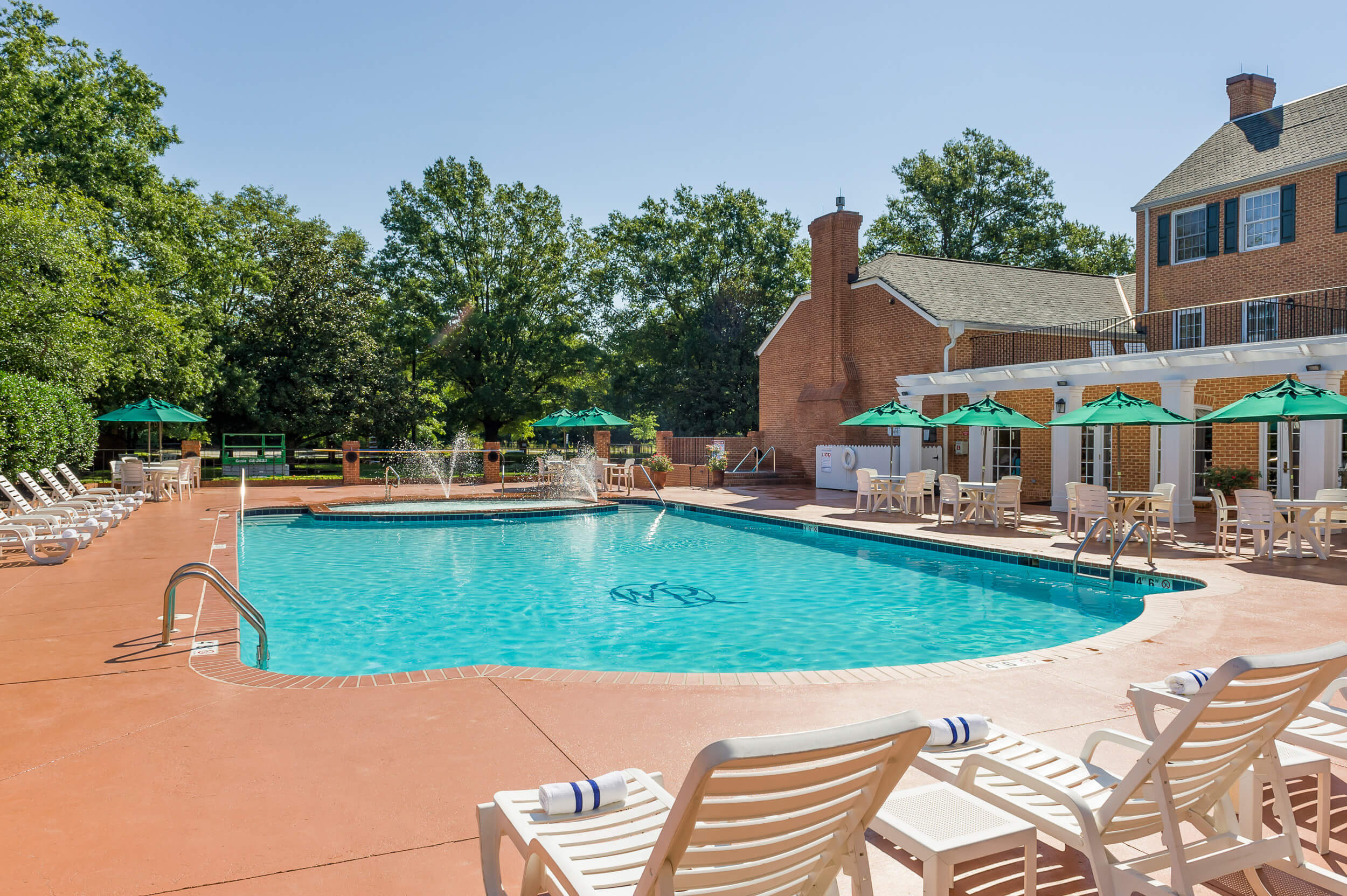 Heated outdoor pool with hot tub and lounge chairs | Westgate Historic Williamsburg Resort