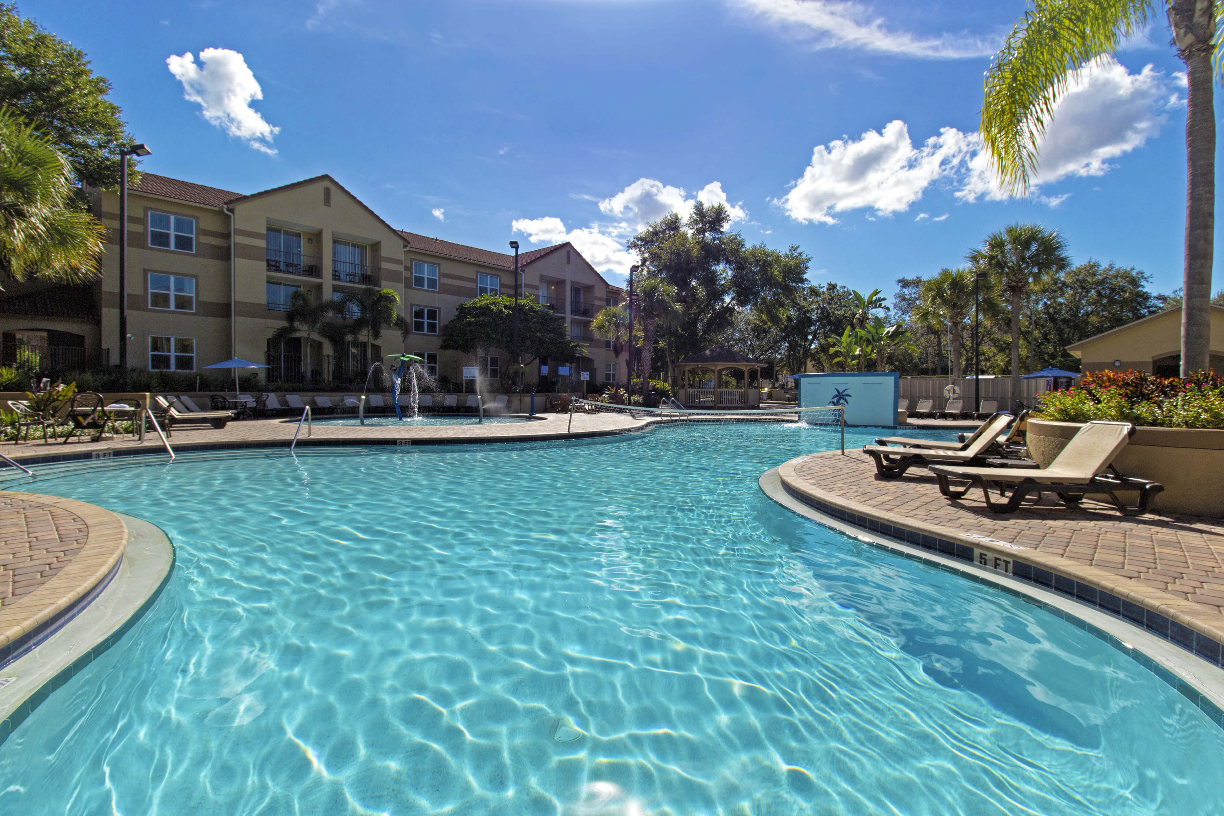 Large outdoor pool with volleyball net | Westgate Blue Tree Resort | Westgate Resorts Orlando