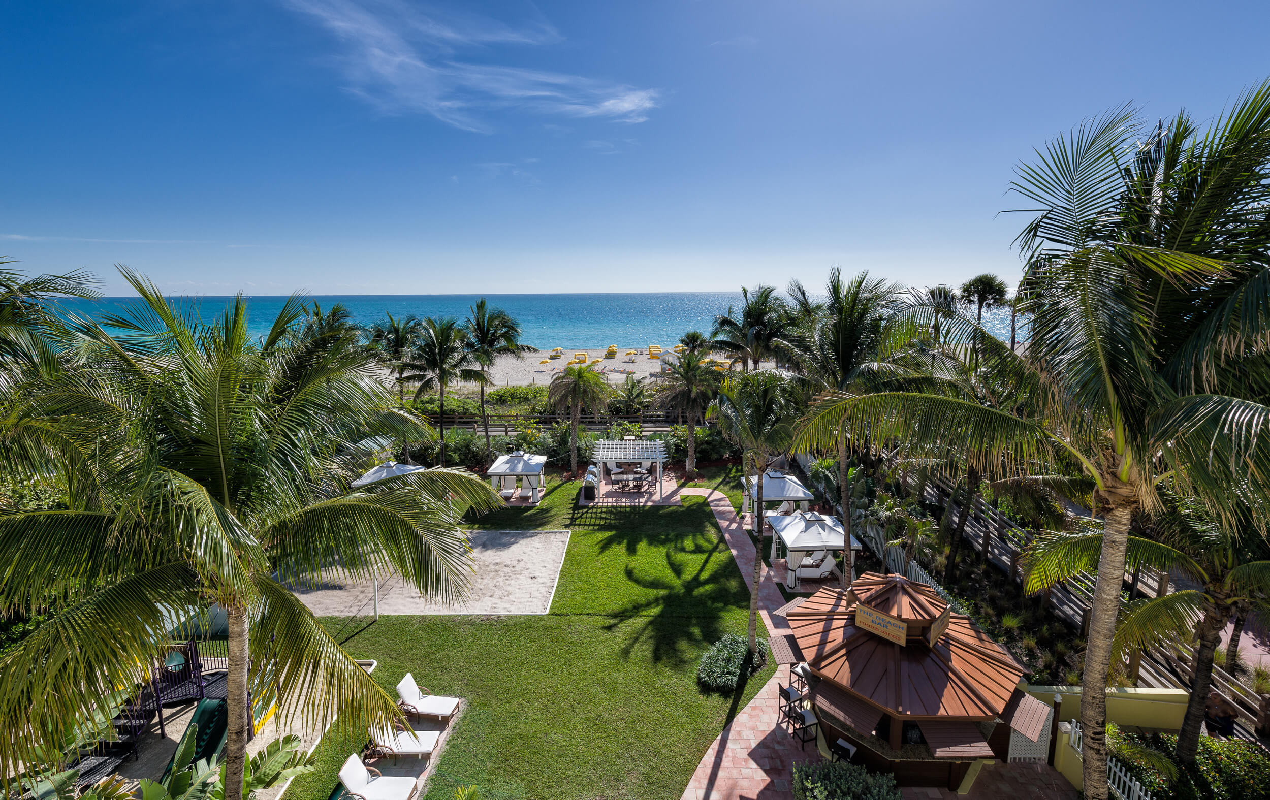 Resort grounds with volleyball court, beach bar and private cabanas | Westgate South Beach Oceanfront Resort