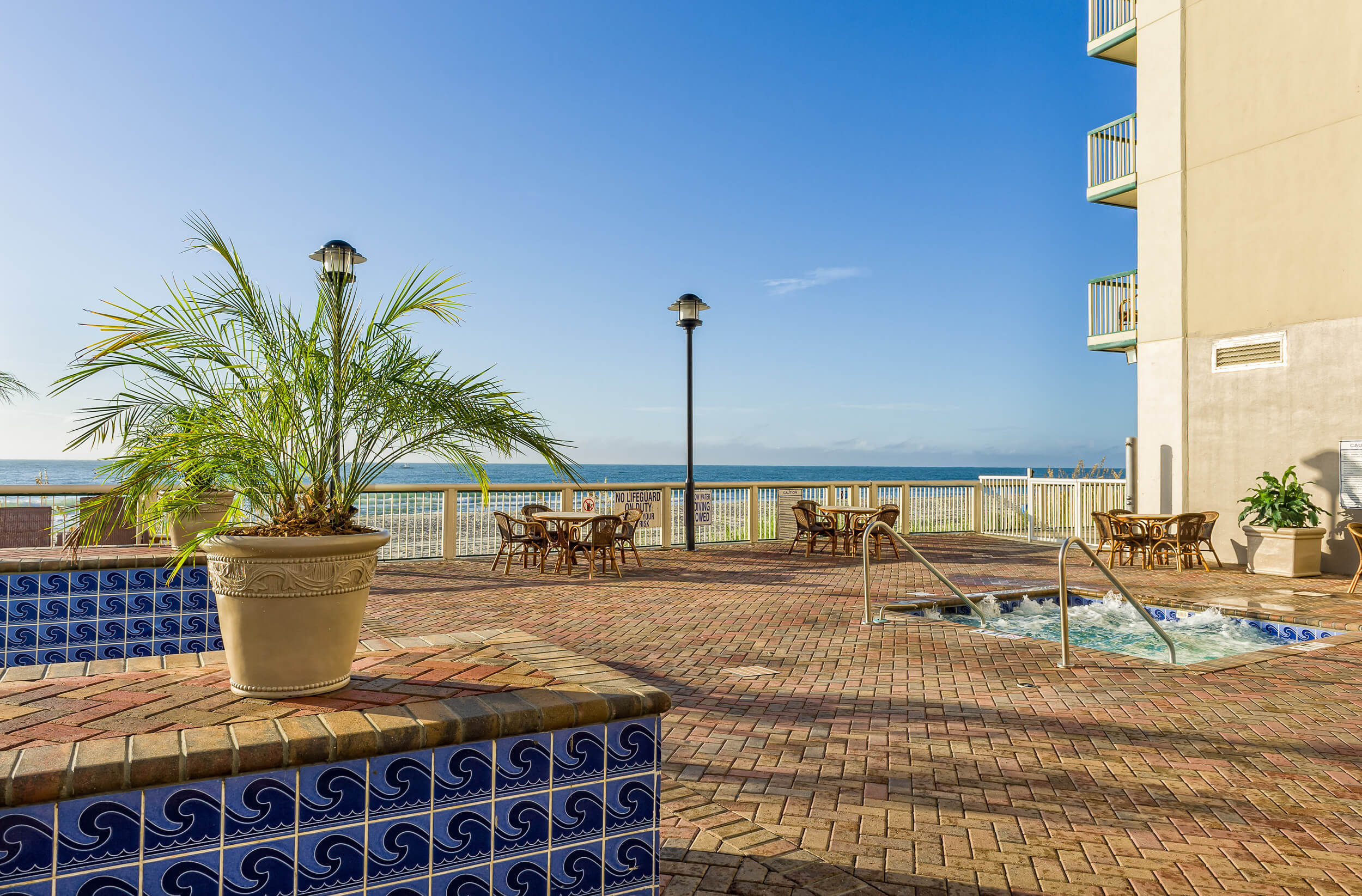 Outdoor beachfront deck with tables and chairs | Westgate Myrtle Beach Oceanfront Resort