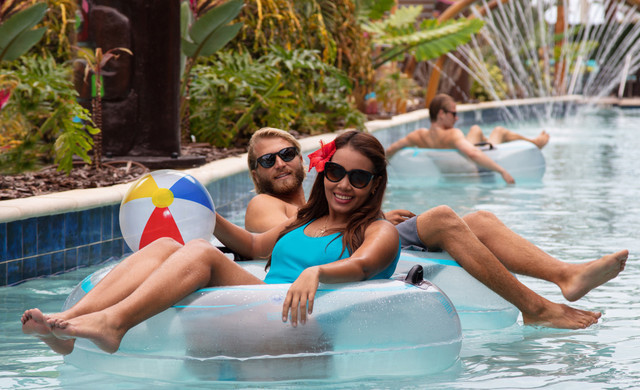 westgate travel club - couple floating down lazy river