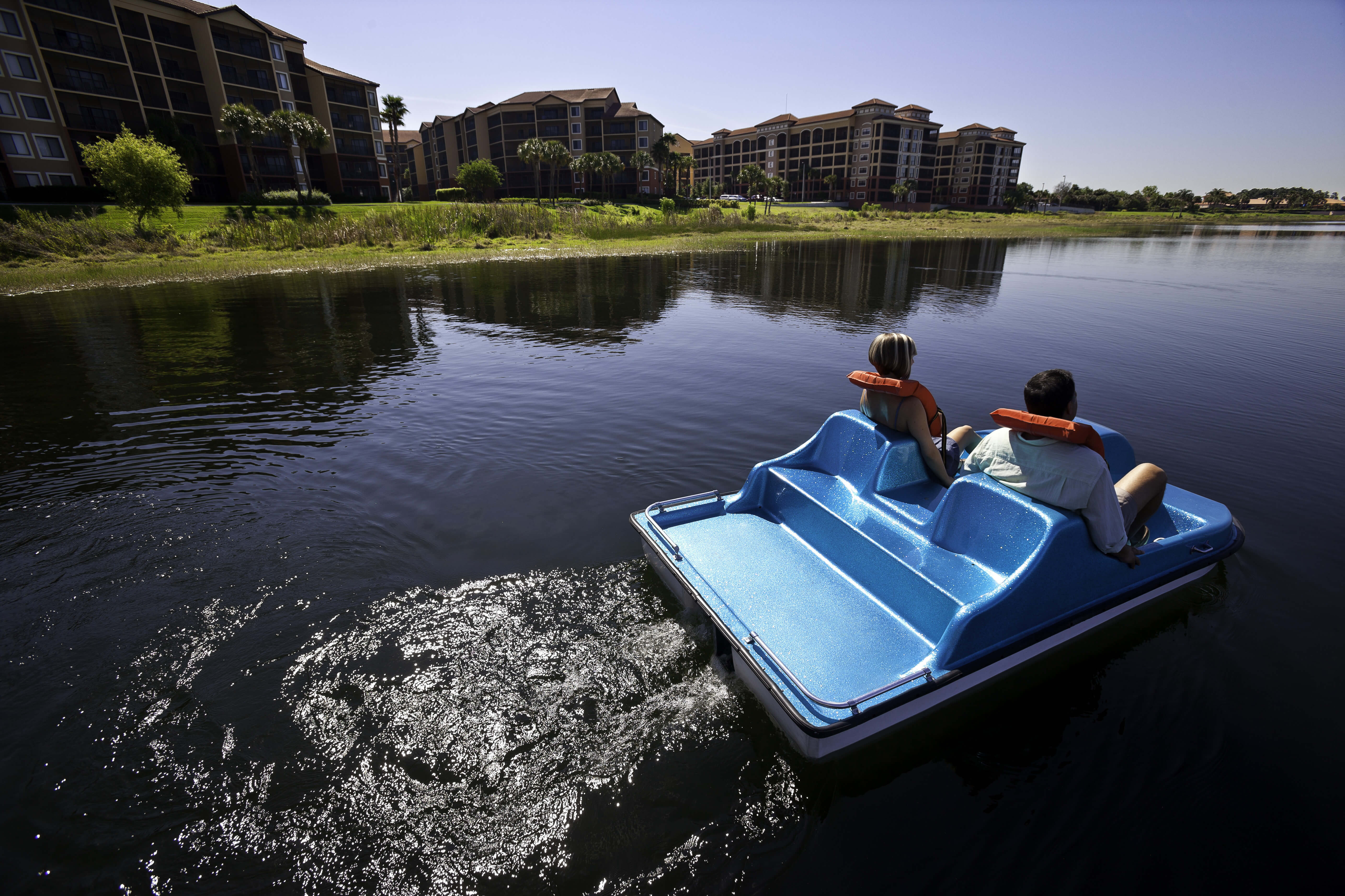 Couple on Paddleboat | Westgate Lakes Resort & Spa | Westgate Resorts