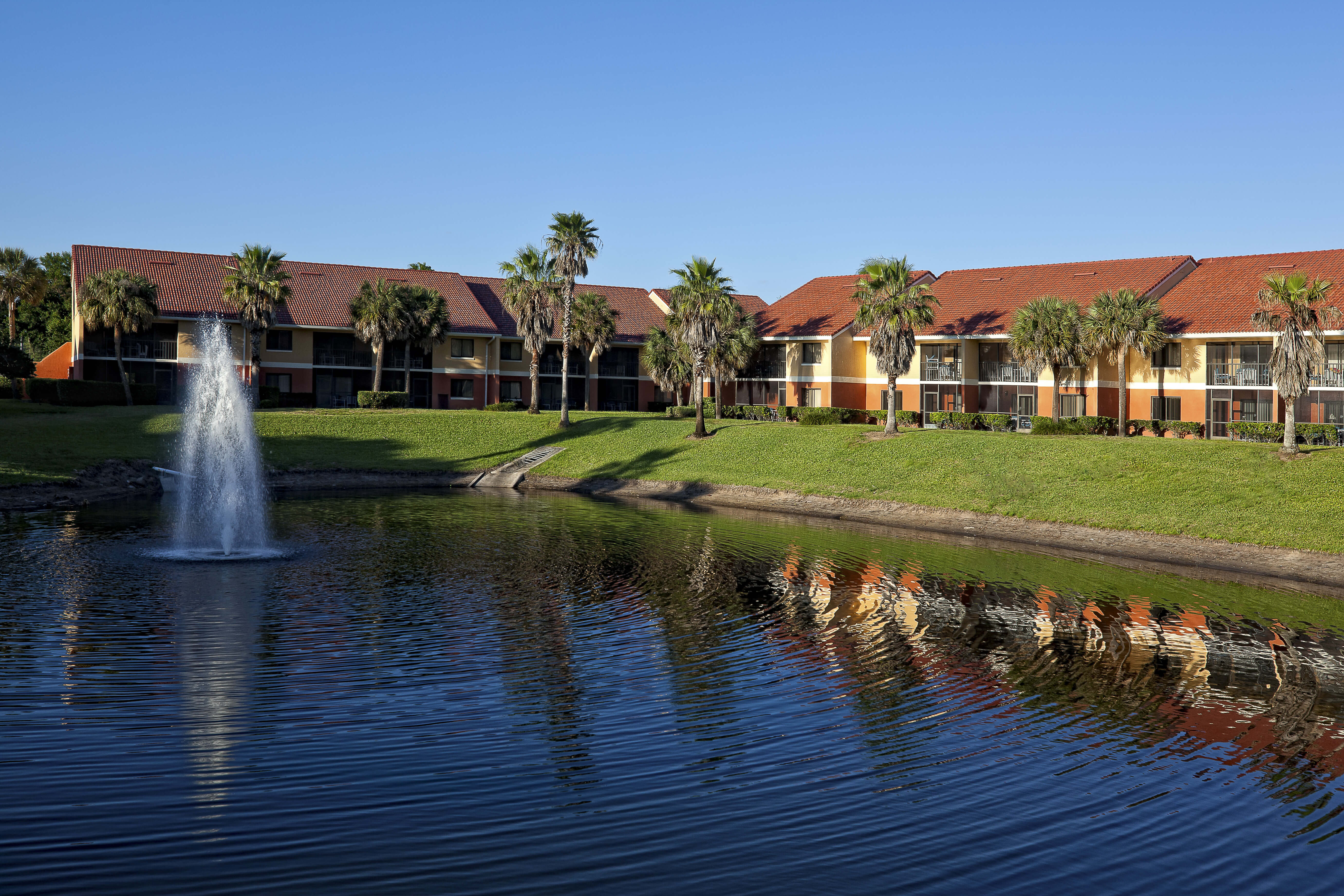 Exterior View of Villas from Lake | Westgate Vacation Villas Resort & Spa | Orlando, FL | Westgate Resorts