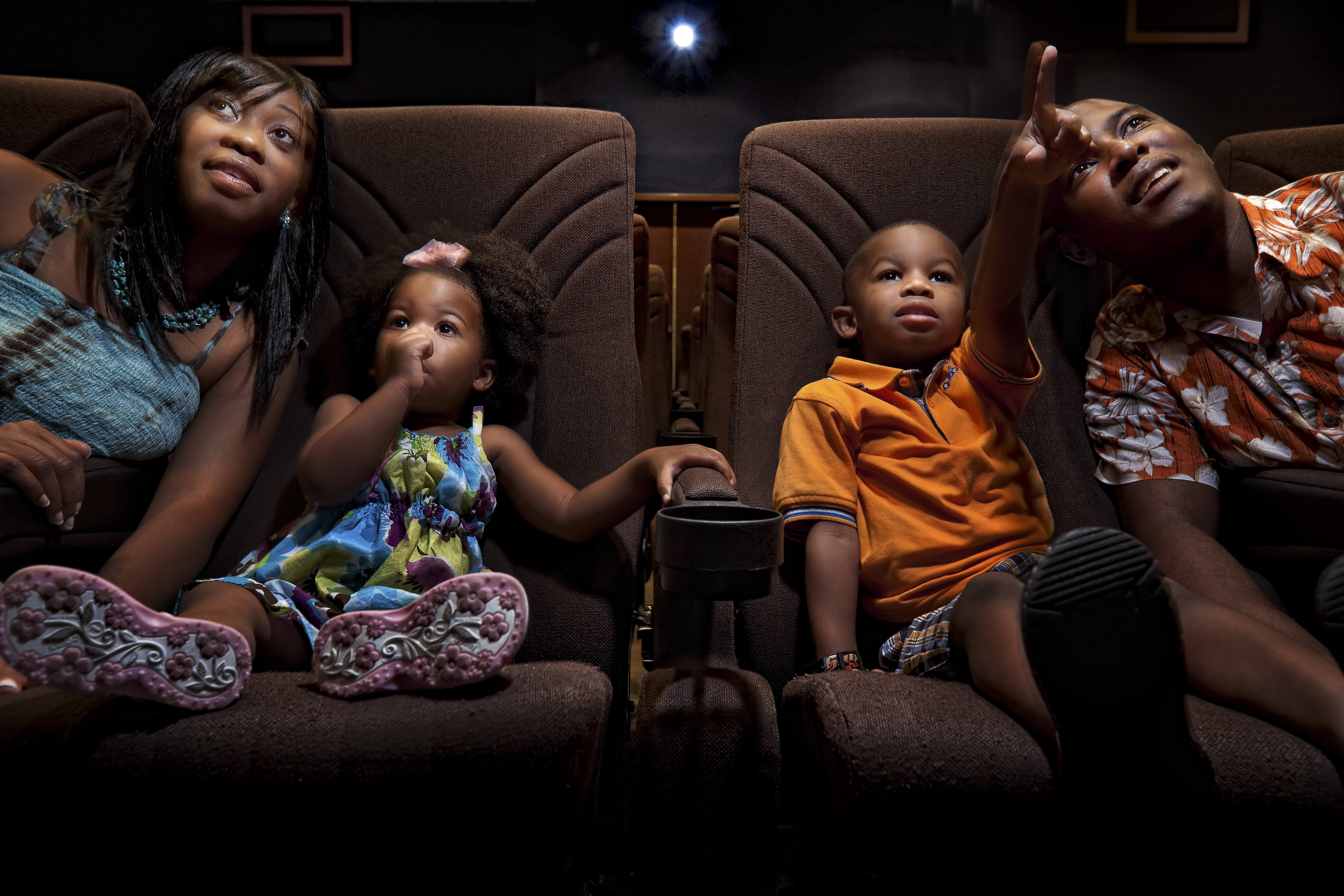 Family enjoying movie at Disney Movie Theater | Westgate Town Center Resort & Spa