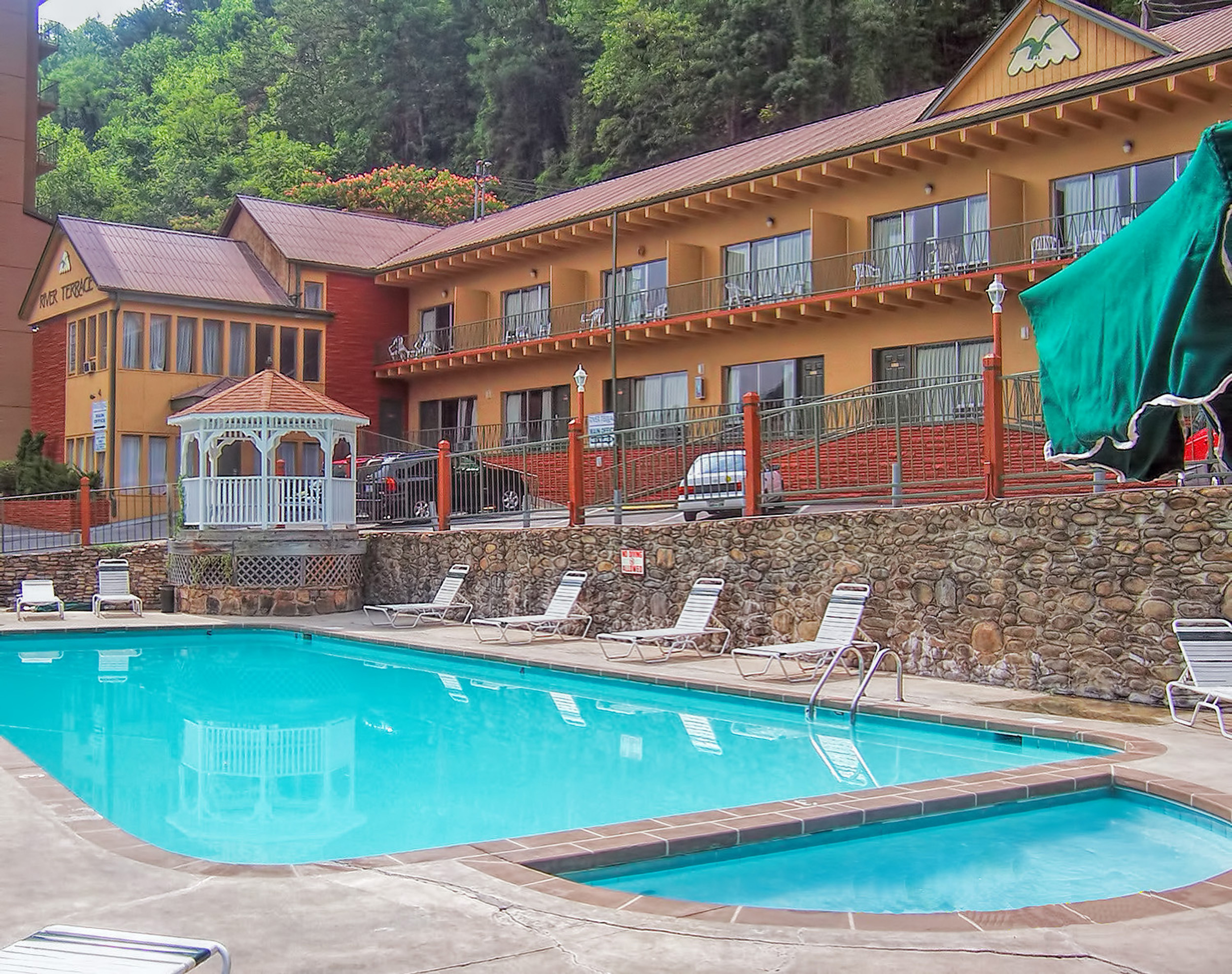 Heated outdoor pool with lounge chairs and gazebo | River Terrace Resort & Convention Center | Westgate Resorts