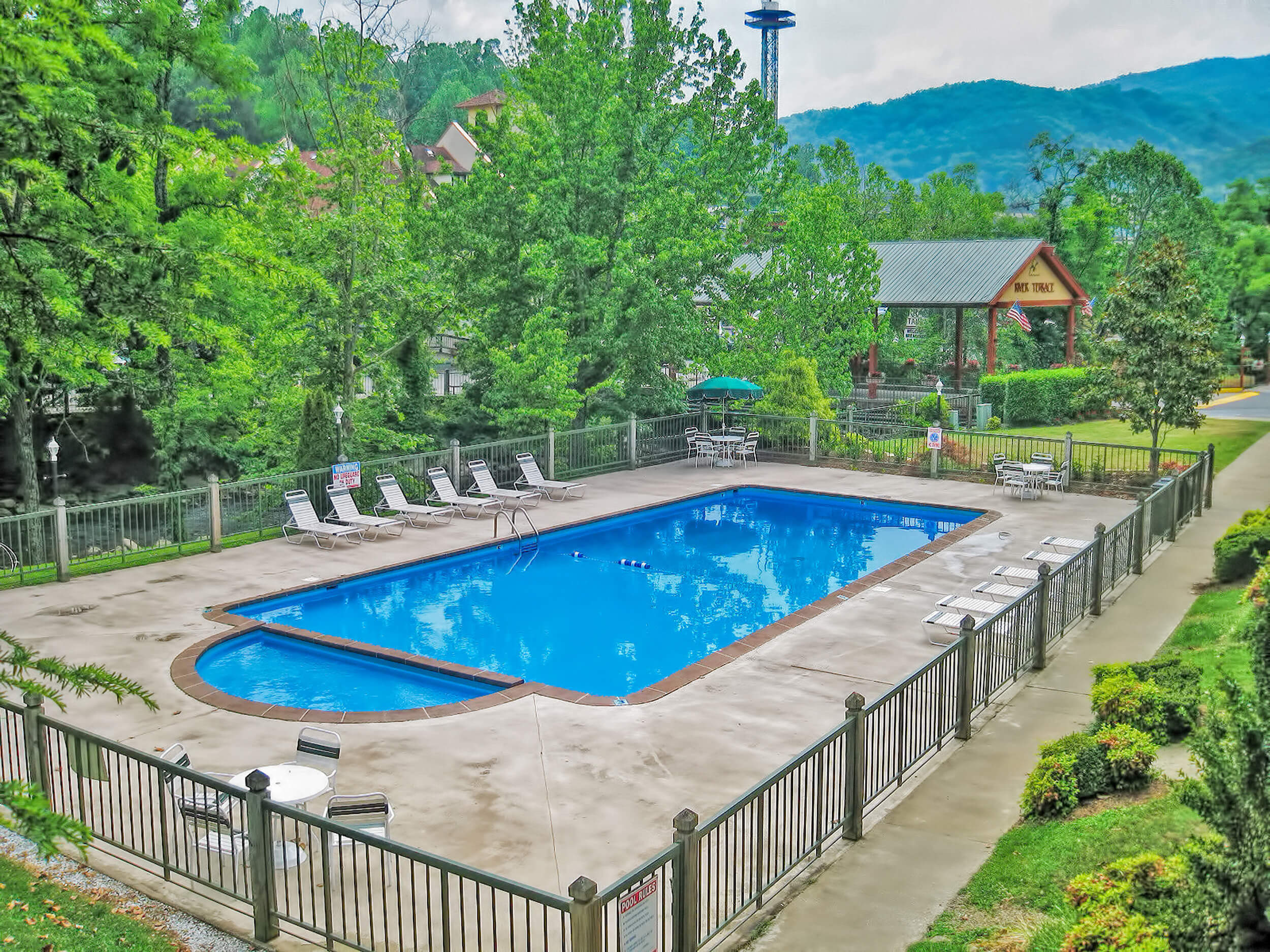 Heated outdoor pool with mountains in background at the Gatlinburg Convention Center Resort | River Terrace Resort & Convention Center | Westgate