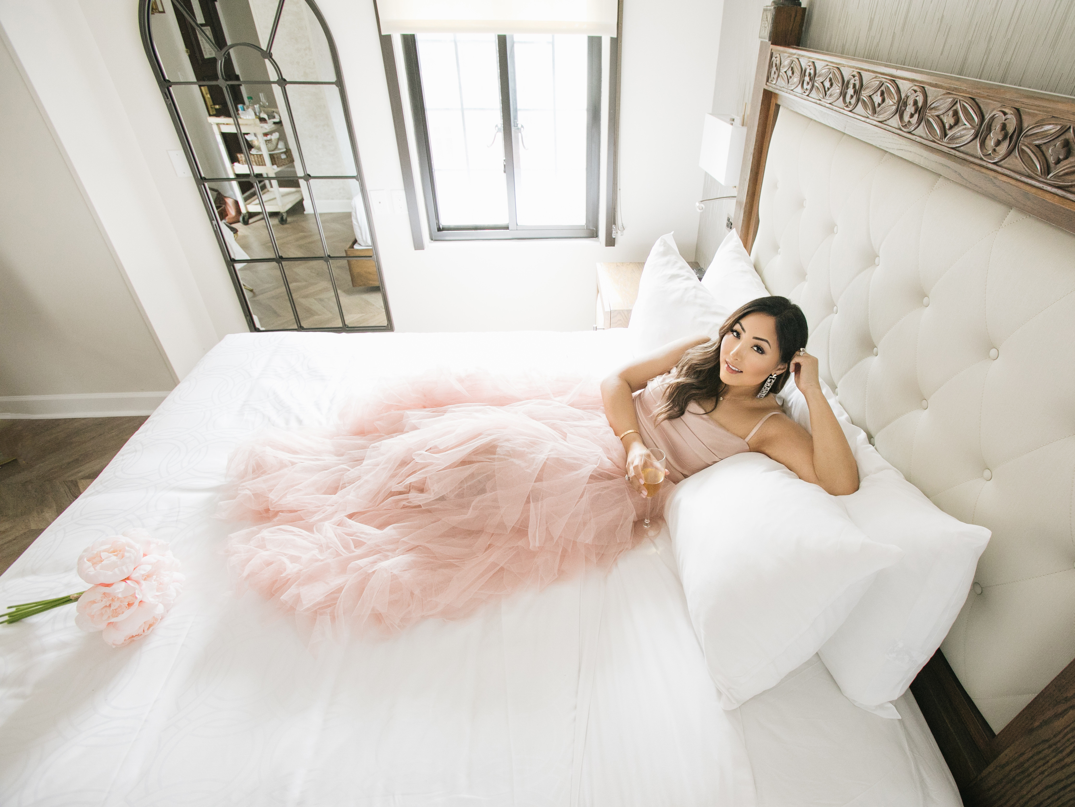 Exclusive Hotel Add-Ons at Westgate New York Grand Central - Woman sitting on suite balcony