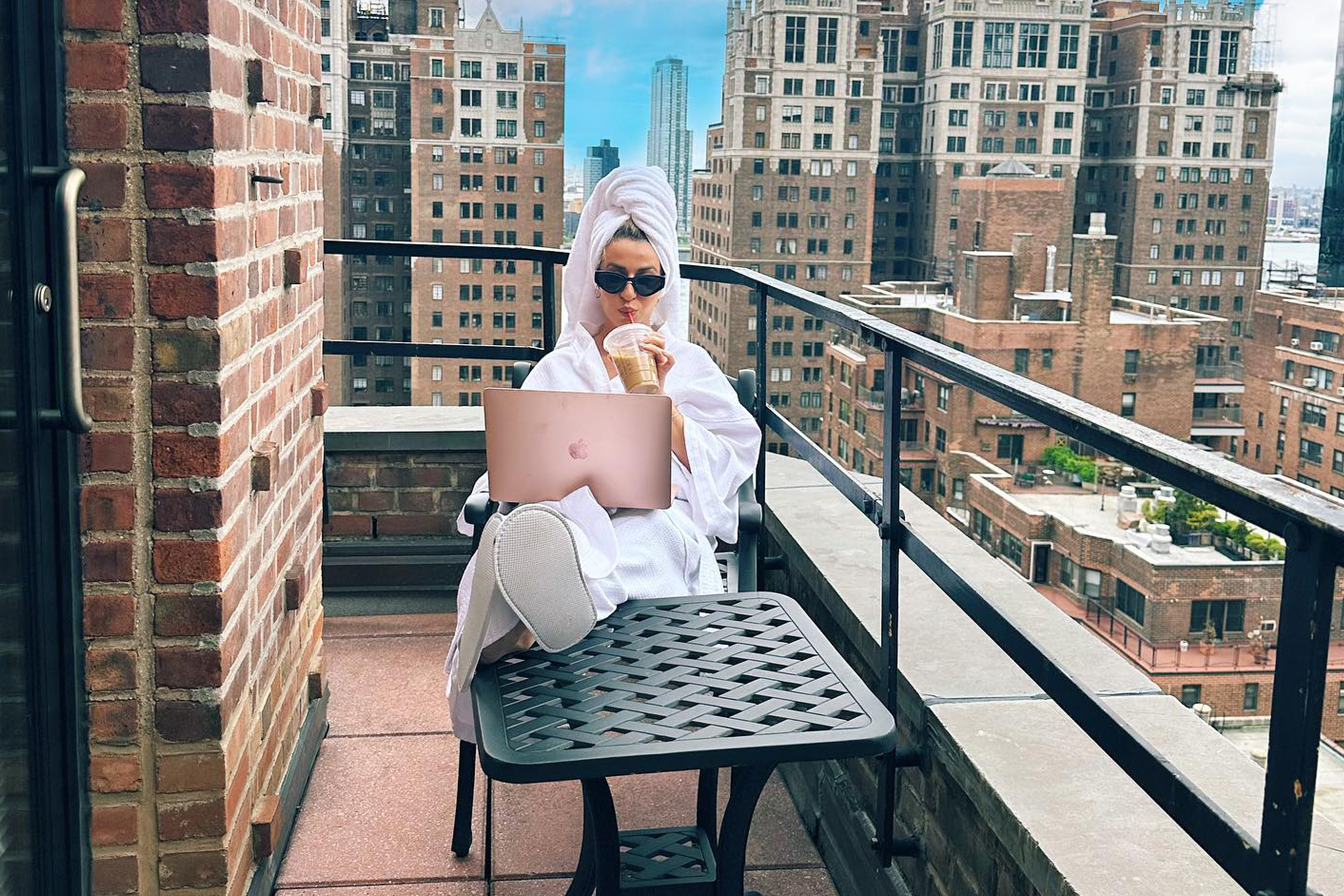 Lowest Wow Loyalty Member Offer - Woman sitting in Suite Balcony