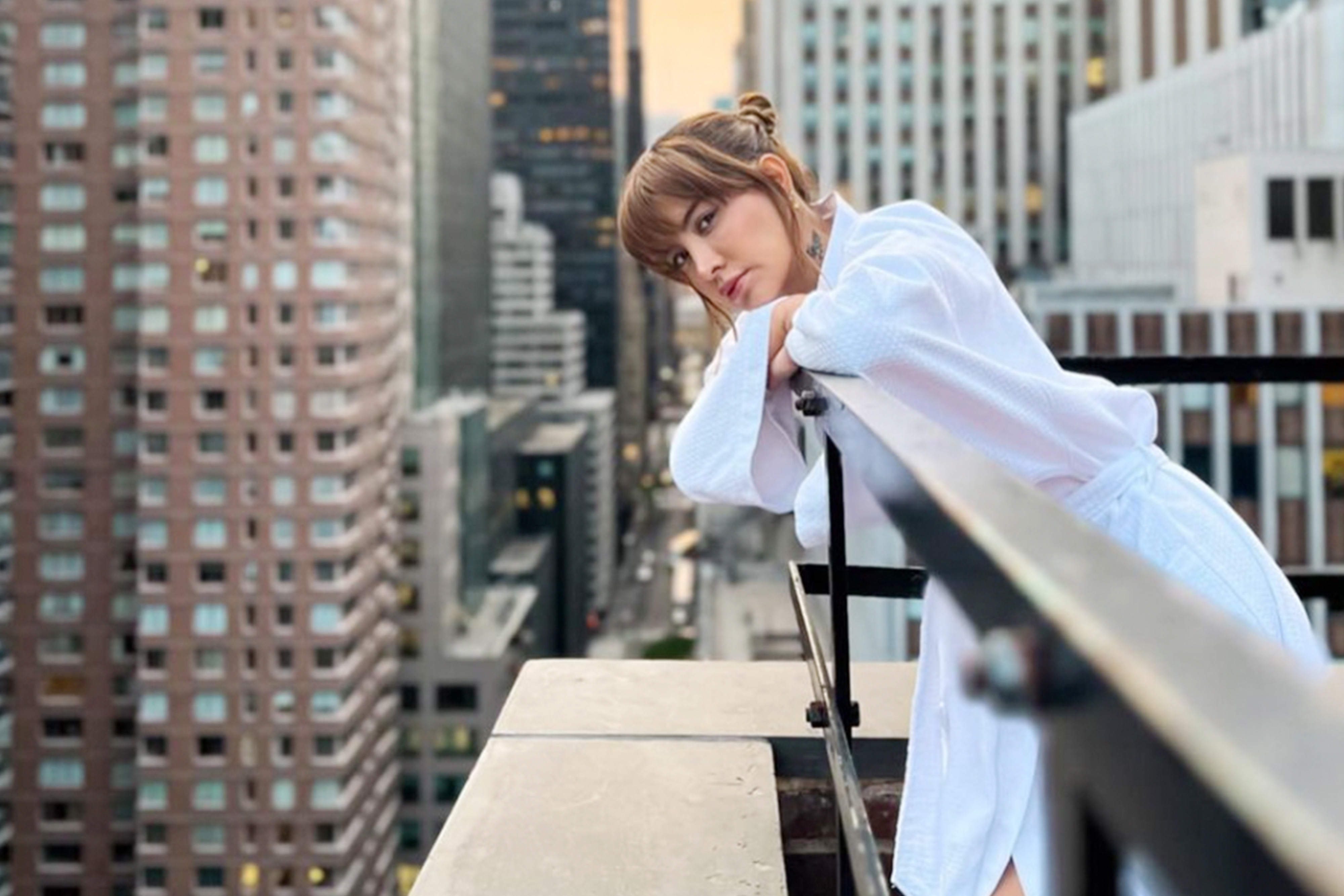 Woman standing in suite balcony- Westgate New York Grand Central