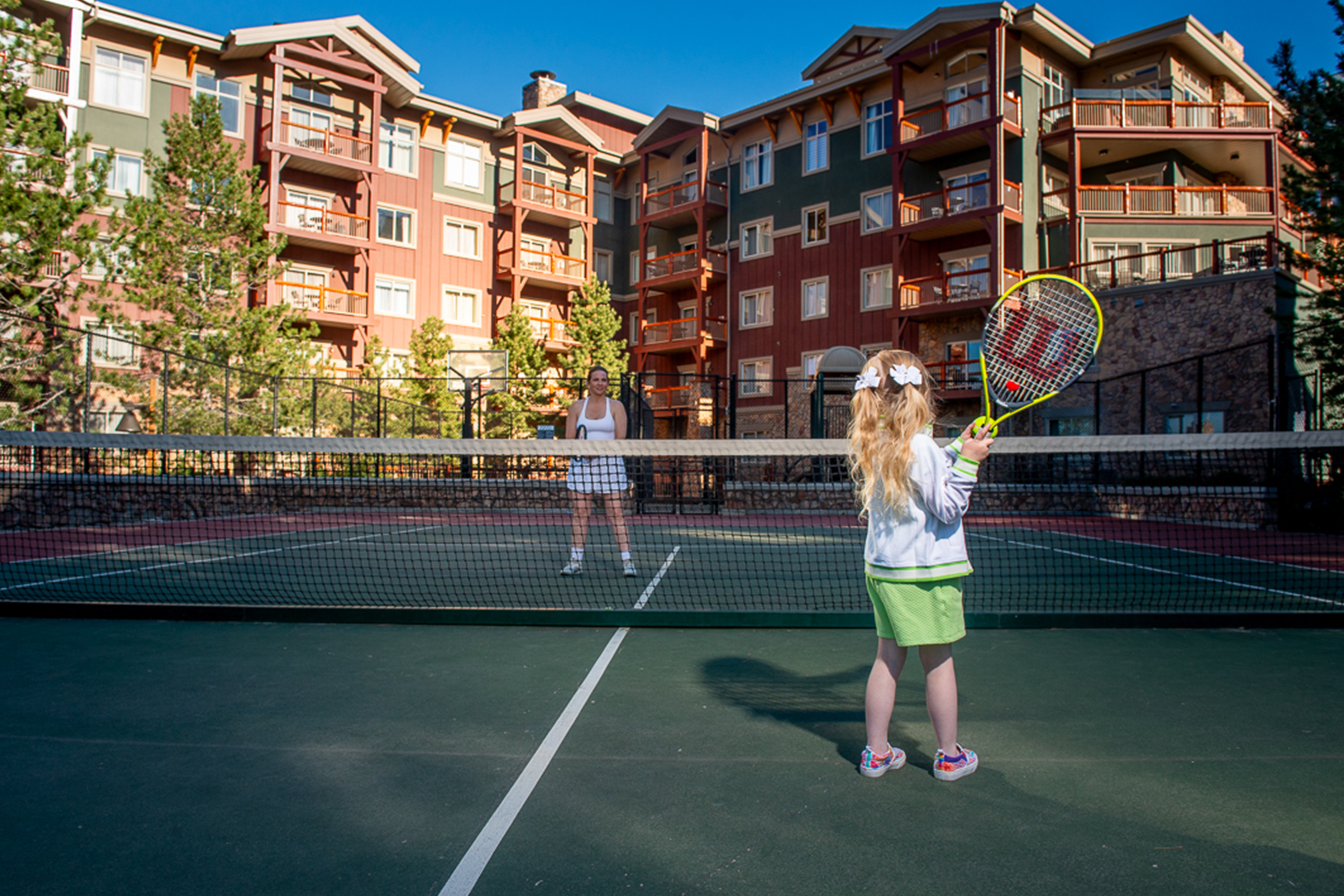 Mother and daughter at tennis court
