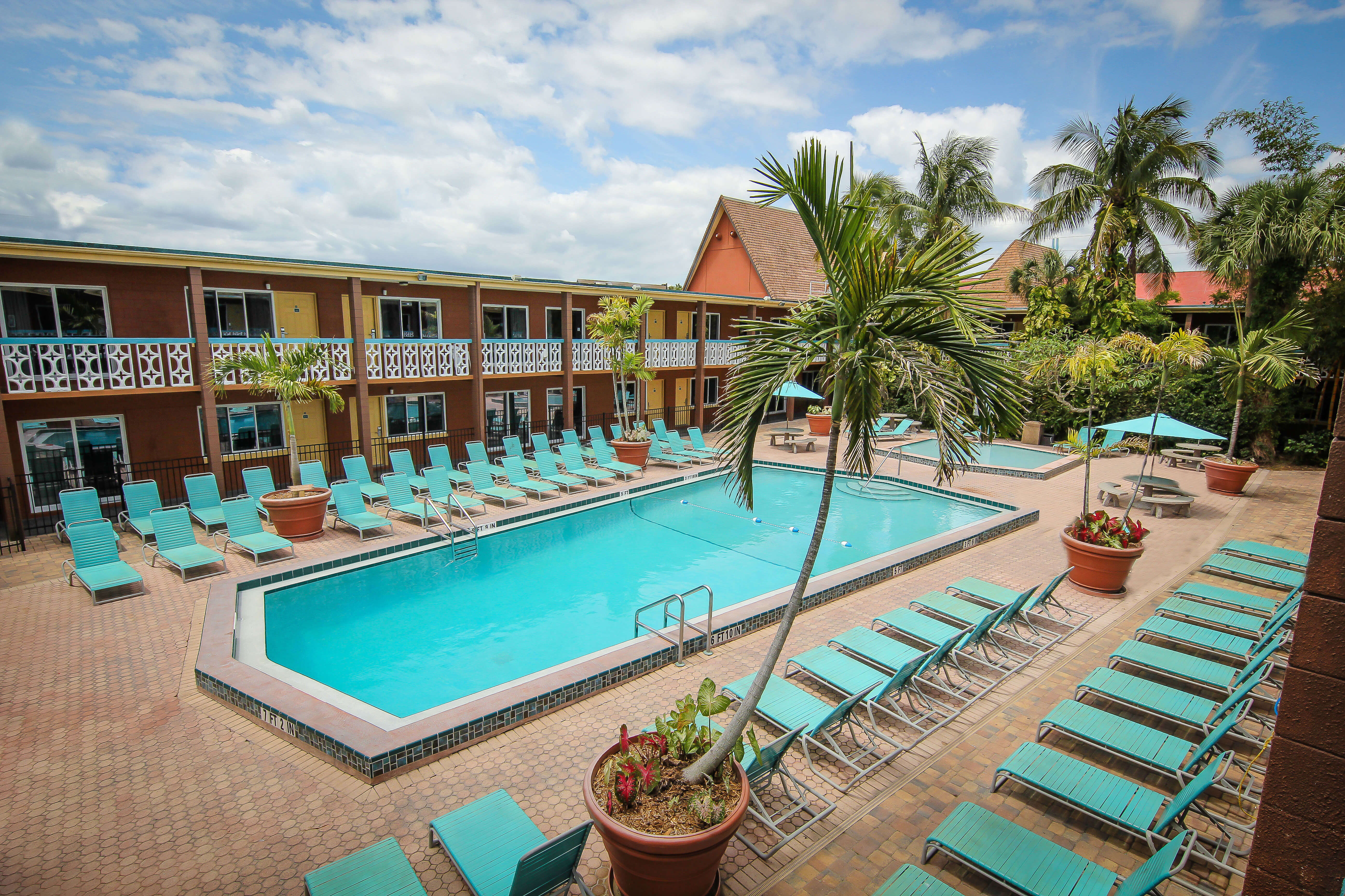 Heated outdoor pool with lounge chairs | Wakulla Suites a Westgate Resort | Westgate Cocoa Beach Resorts