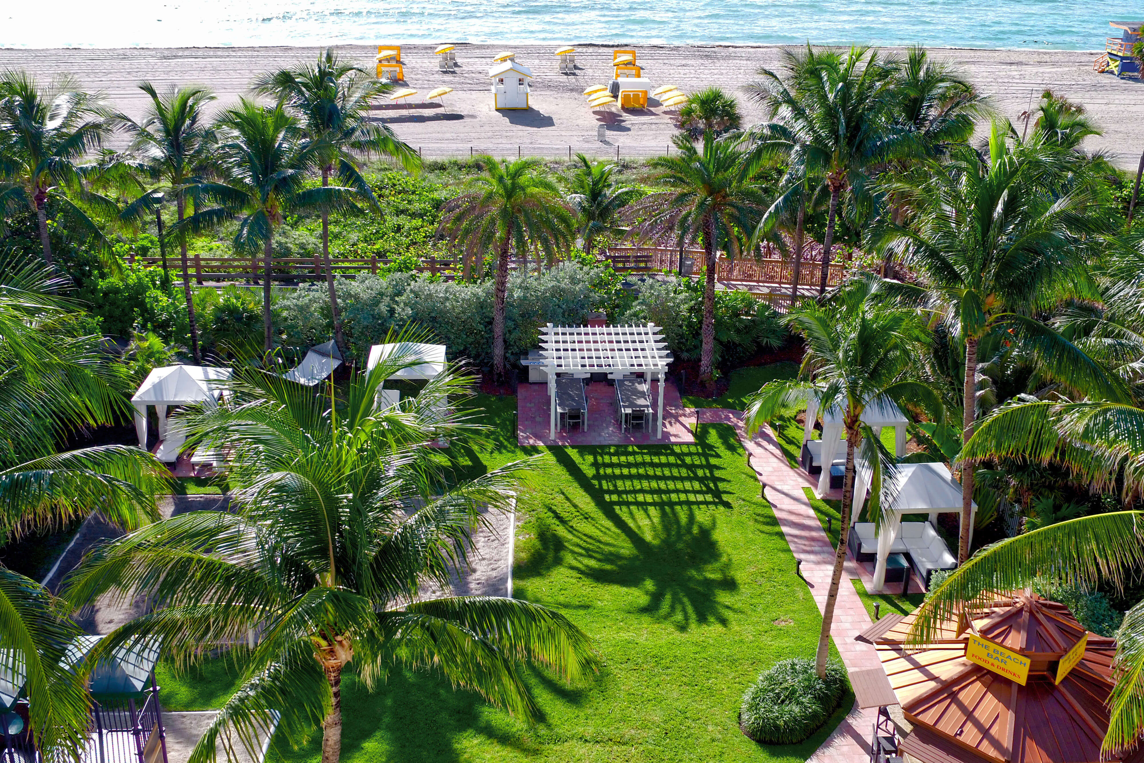 Tropically landscaped oceanfront resort with volleyball court and private cabanas | Westgate South Beach Oceanfront Resort