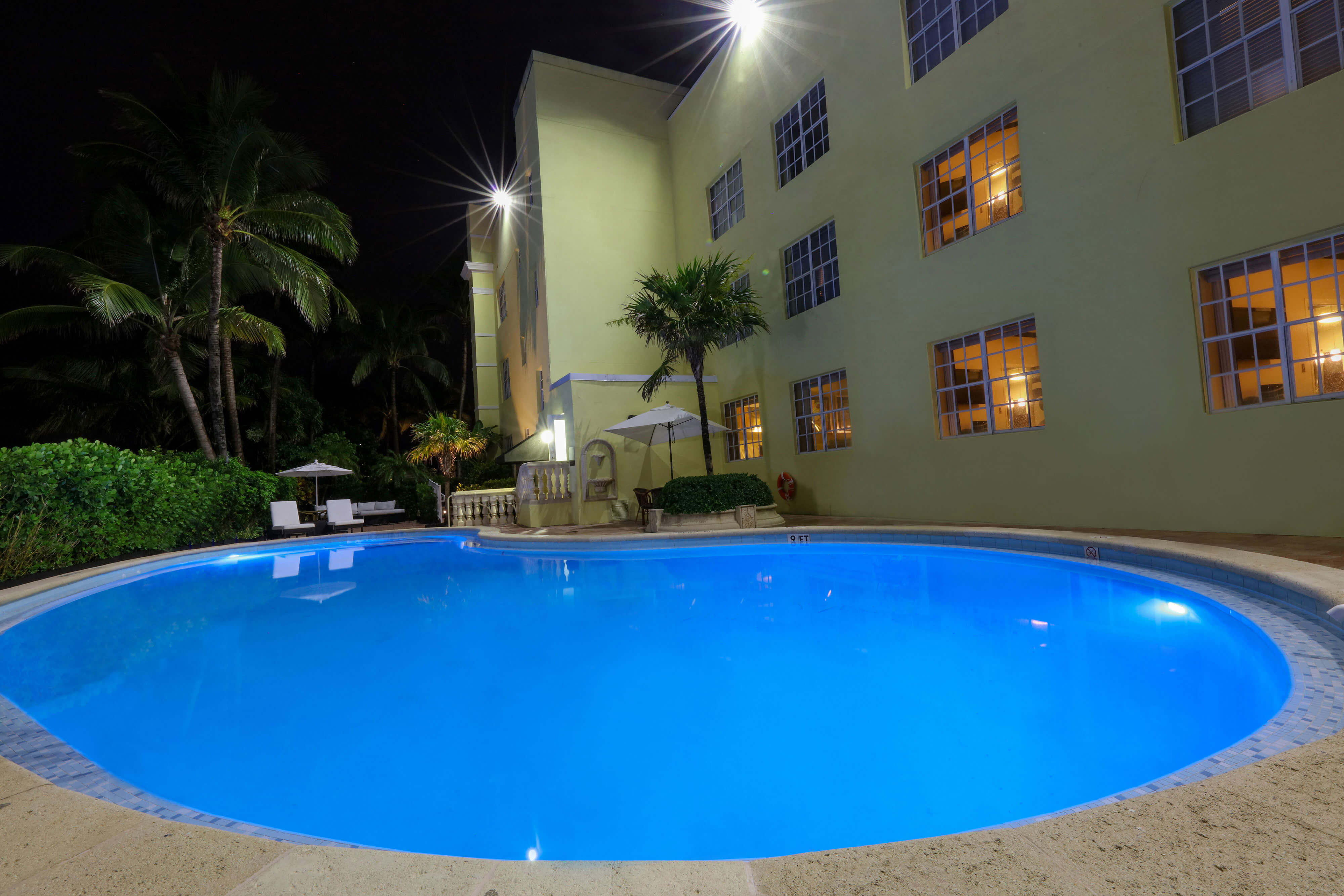 Tropical Oasis Pool with lounge chairs and umbrellas | Westgate South Beach Oceanfront Resort